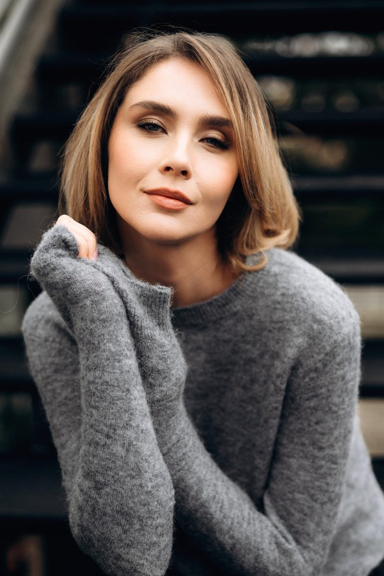 A woman with a softly polished, natural finish to her hair.